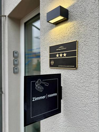 a sign on the side of a building at Hotel-Bistro-Europa in Merchweiler