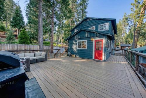 a blue tiny house on a wooden deck at Tahoe City Gem Pet Friendly Yard Walk to Beach in Tahoe City