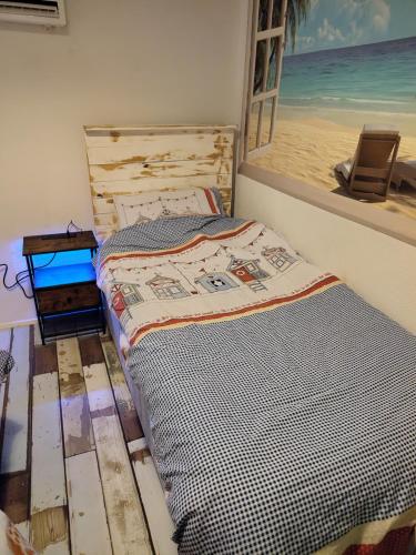 a bed in a room with a view of the beach at ElE G Holiday let's Bridlington in Bridlington