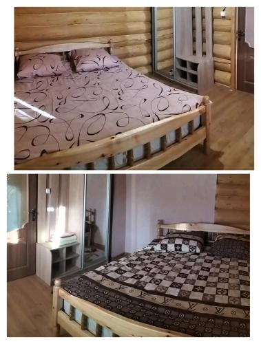 a bedroom with a bed with a wooden frame at Садиба для відпочинку in Vyshka