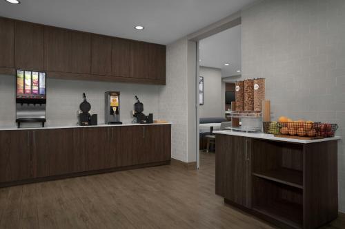 a lobby with a counter with fruit on it at Residence Inn by Marriott Newark, DE in Newark