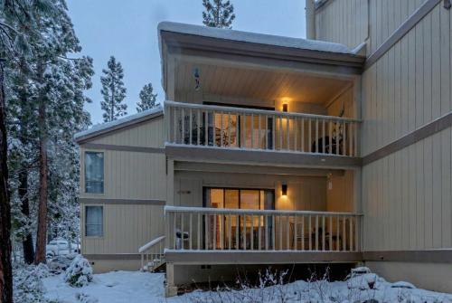 a house in the snow with the lights on at 3BD Three Minutes from King Beach in Kings Beach