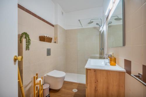 a bathroom with a sink and a toilet at Ocean View - XL Terrace - Beachfront by Tenório in Lagos