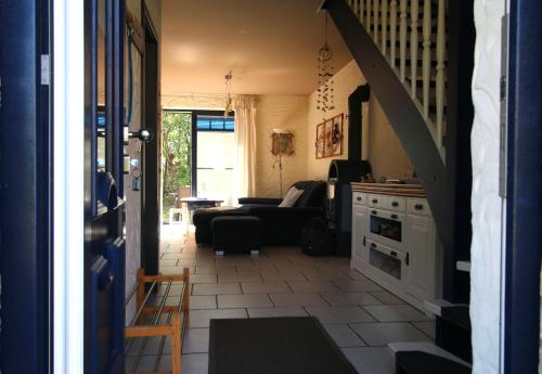 a living room with a couch and a table at "Leuchtturm" in Fuhlendorf