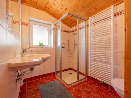 a bathroom with a shower and a sink at Pehambauer S in Hüttau