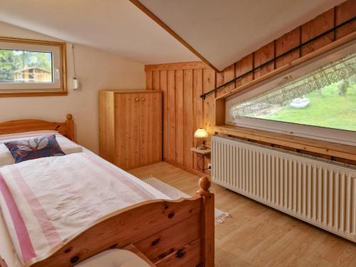 a bedroom with a large bed and a window at Neubert in Breitenbrunn