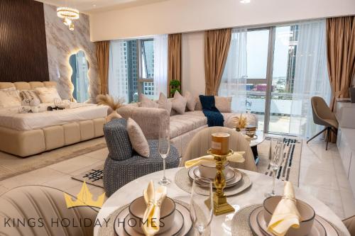 a living room with a couch and a table at Central Park towers residence difc in Dubai