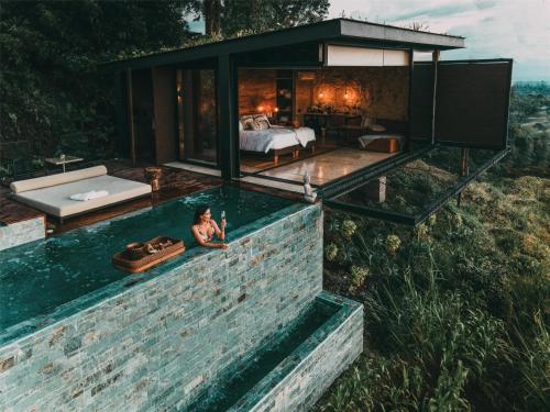 a pool in the middle of a house at Bio Habitat Hotel, AKEN SOUL Collection in Armenia
