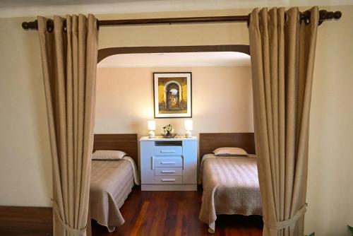 Llit o llits en una habitació de Eden Royal House
