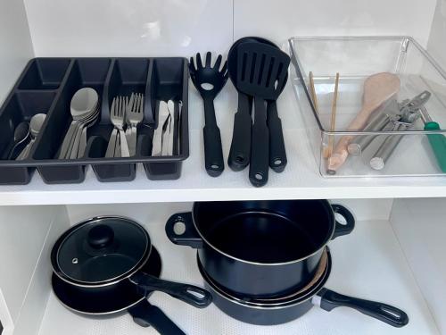 a kitchen counter with utensils and utensils at u5-Traditional QLD unit with backyard-Fresh-Quiet Leafy Centre-NewAC SmartTV in Brisbane