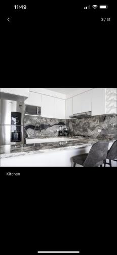 a black and white photo of a kitchen at Hermosa y acogedora casa en comunidad privada in Mazatlán