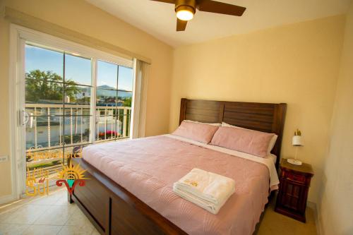 a bedroom with a bed and a large window at Villa Del Sol in Ixmiquilpan