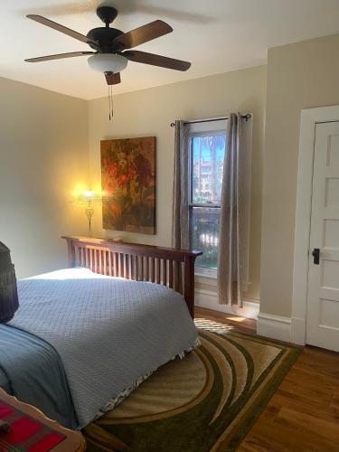 a bedroom with a bed and a ceiling fan at Suite in Downtown Riverside in Riverside