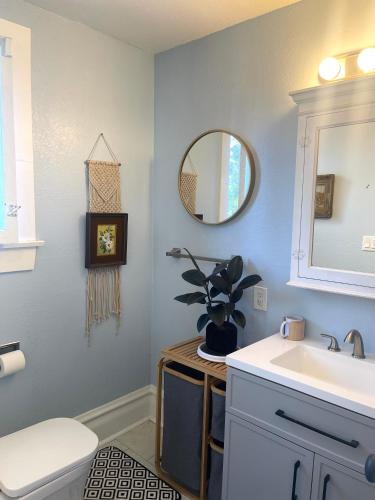 a bathroom with a sink and a mirror at Suite in Downtown Riverside in Riverside
