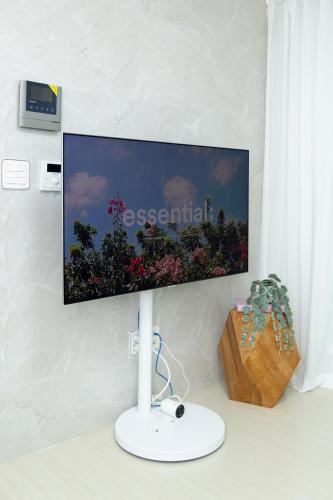 a flat screen tv on a wall in a room at ABC Stay in Seoul