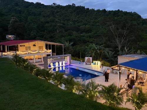 an aerial view of a house with a swimming pool at Finca Villa Carmen, Vía Magdalena in Villeta