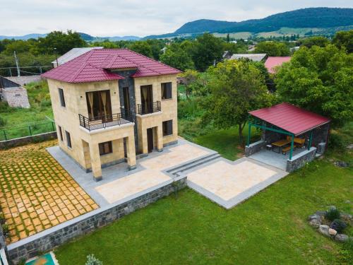 an overhead view of a house with a red roof at Canyon View Dsegh in Dsegh