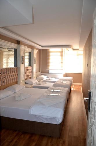 a row of beds in a room at Sun Comfort Hotel in Istanbul