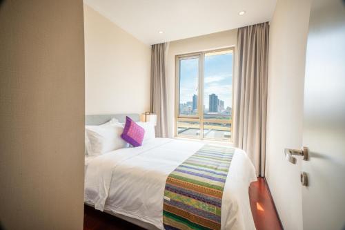 Krevet ili kreveti u jedinici u okviru objekta One Park Hotel & Residence