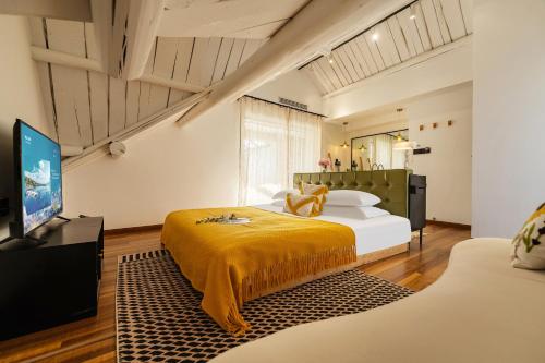 a bedroom with two beds and a flat screen tv at Muse Garden in Shanghai