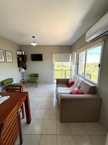a living room with a couch and a table at Departamento Capital II in La Rioja