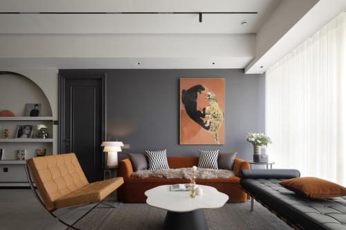 a living room with a couch and a table at ChangSha YunXi Riverview Hotel in Changsha