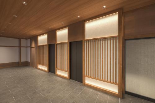 a hallway with wood paneling and windows in a building at Via Inn Prime Kumamoto in Kumamoto