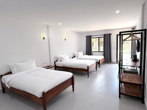 For Rest Inn tesisinde bir odada yatak veya yataklar