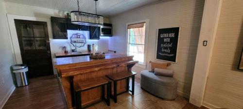 a bar in a room with a wooden table at Clemson Memorabilia House Frank Howard III Home in Clemson