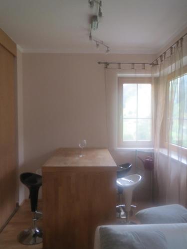 a room with a table and two chairs and a window at Ascherhof in Auffach
