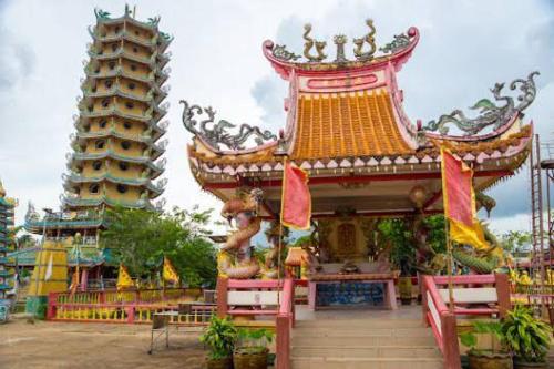 a building with a pagoda and two towers at Sairung Farmstay and Cawboy Krabi in Ban Nua Khlong