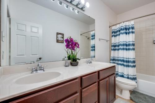 a bathroom with a sink and a toilet at Stunning Home near Universal Kids Resort, Frisco in Little Elm