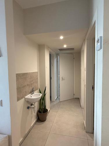 a bathroom with a sink and a toilet at Shemesh Boutique in Beit Shemesh