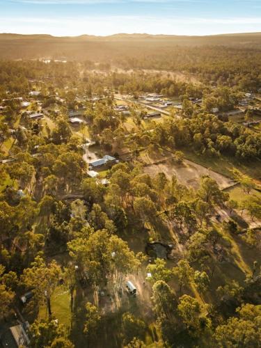an overhead view of a town with trees and buildings at 5 Acre Retreat Jimboomba by Tiny Away in Jimboomba