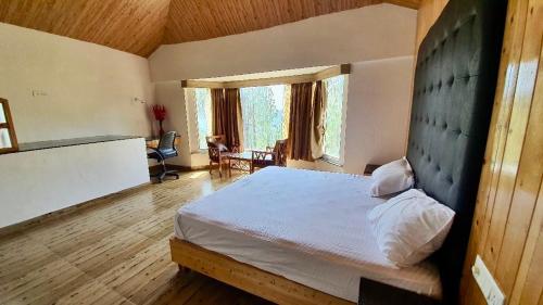 a bedroom with a large bed in a room at Blue Pine Orchards in Lansdowne