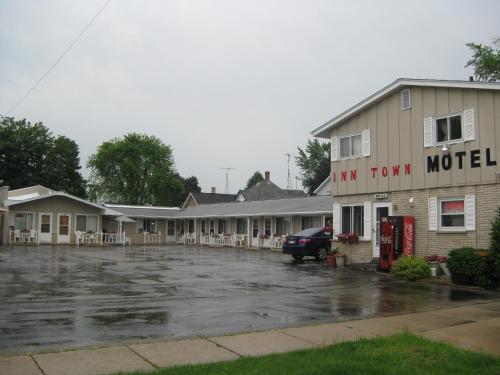 a parking lot in front of a motel at Inn Town Motel in Waupun