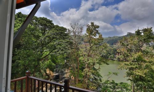 a view of a river from a balcony at Viyana Boutique Hotel in Kandy