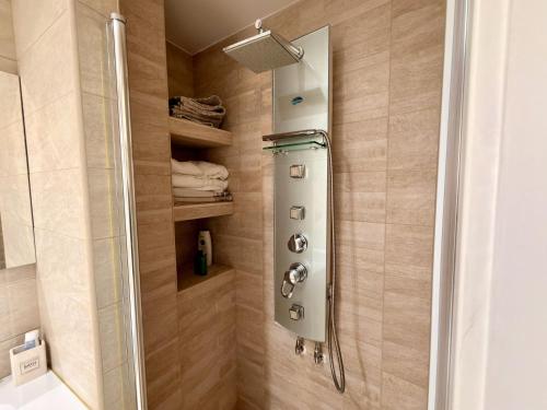 a shower with a glass door in a bathroom at Dimora Imperiali in Francavilla Fontana