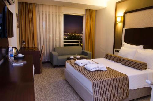 Katil atau katil-katil dalam bilik di Lavin Hotel & Spa