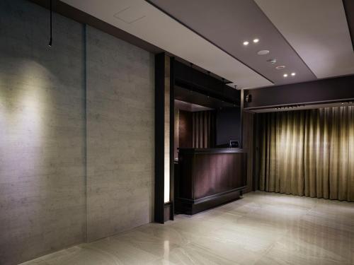 a hallway with a podium in a building at At Home Hotel Ximen in Taipei