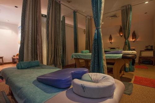 Postel nebo postele na pokoji v ubytování Avalon Courtyard Residence Suites