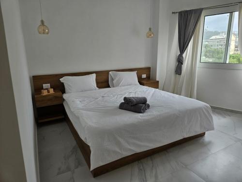 Llit o llits en una habitació de Kaia Guest House