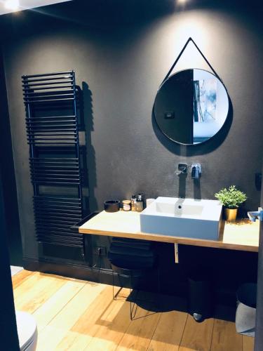 a bathroom with a sink and a mirror on the wall at ML32 in Ravenna