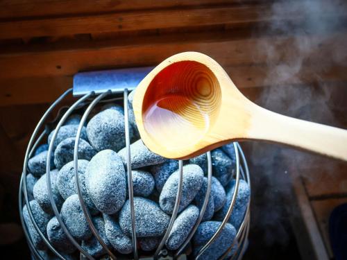 a wooden spoon and a basket of donuts at 甚兵衛邸 in Hirado