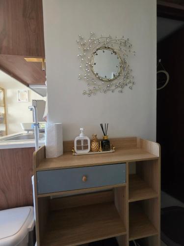 a dressing table with a mirror on the wall at Saekyung Lapu-lapu in Suba