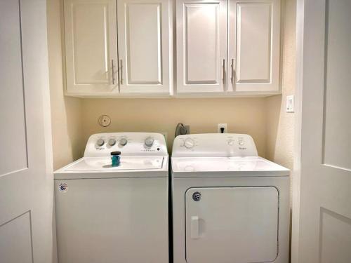 a small kitchen with a stove and a sink at Stunning 1BR near The Heights with BBQ, Gym & Pool in Houston