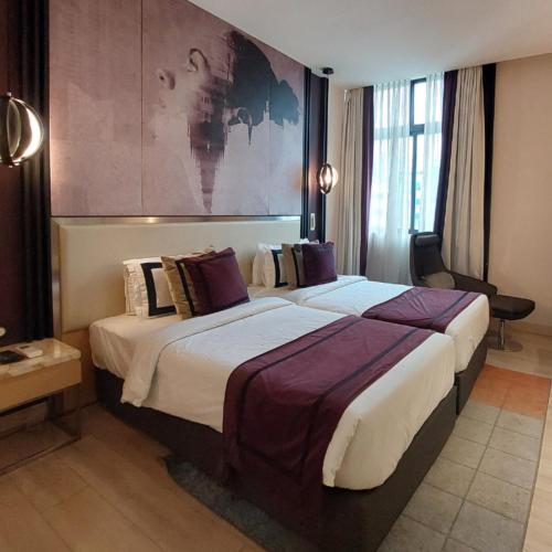 a large hotel room with a large bed in it at BEYZAA HOTEL AND SUITES in Kolkata
