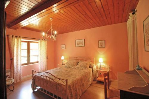 a bedroom with a bed and a wooden ceiling at Beaufort in Blond