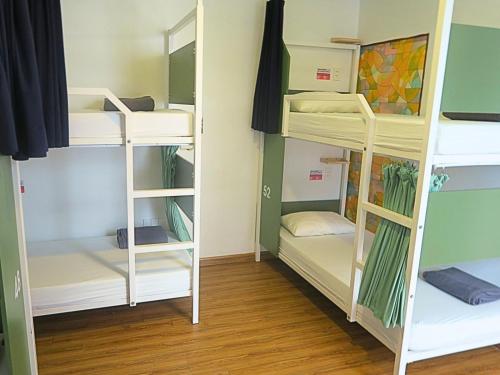 a room with bunk beds in a dorm room at Fuse Old Town Hoi An in Hoi An