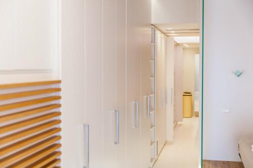 a hallway with white walls and a staircase at B&B Portorosso in Monopoli
